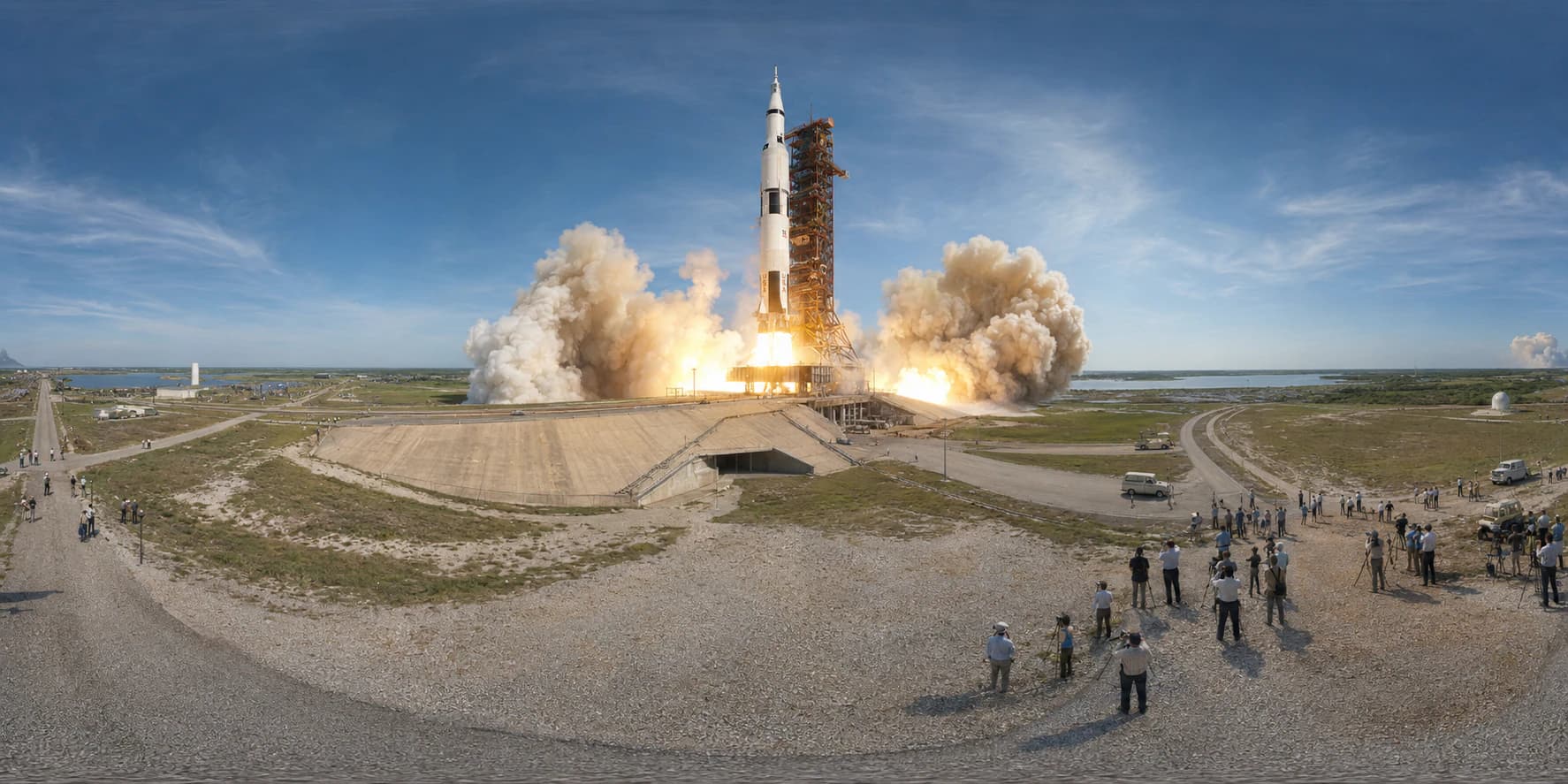 A 360 historical reconstruction of the Apollo 11 launch with the Saturn V rocket, launch tower, smoke plume, flame trench, coastal Florida landscape, 1960s support vehicles, and distant spectators.